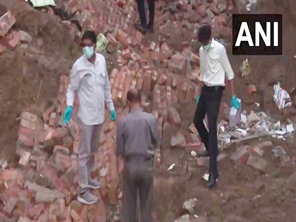 Officials at the site of the collapse of the building in Paharganj in Delhi. (Photo/ANI) 