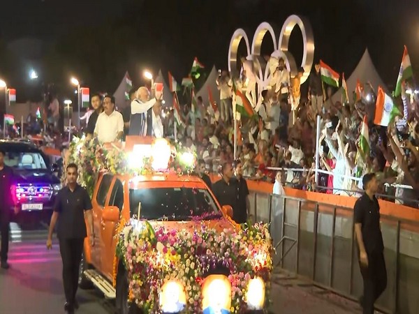 Prime Minister Narendra Modi holds roadshow in Ahmedabad. (Photo/ANI)