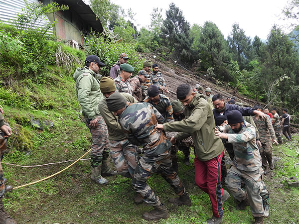 Army personnel conducting rescue operation after landslide hit Sikkim military camp (Photo/ANI)
