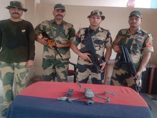 BSF with seized drone and heroin packet from the Amritsar border. (Photo/ANI)
