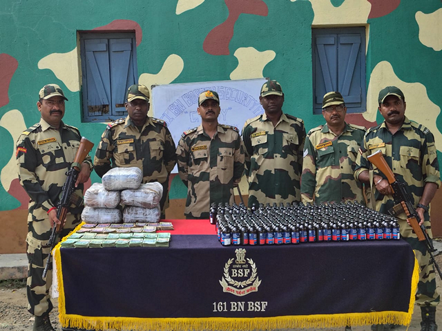 BSF South Bengal Frontier with the seized  currency and contraband items. (Photo/ANI)