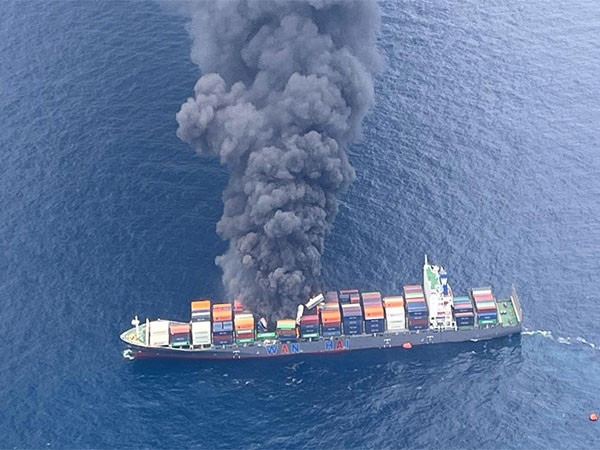 Image shows smoke rising following explosion onboard MV Wan Hai 503 (Image Credit: X/@IndiaCoastGuard)