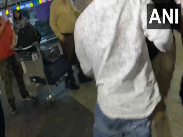 A bystander outside Indore airport tried to hit one of the accused (Photo/ANI)