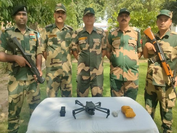 BSF with seized drone, heroin near the Indo-Pak border. (Photo/ANI)