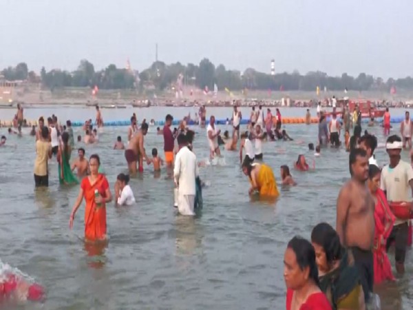 Devotees gather at Prayagraj’s Sangam for a holy dip on Jyeshtha Purnima (Photo/ANI)