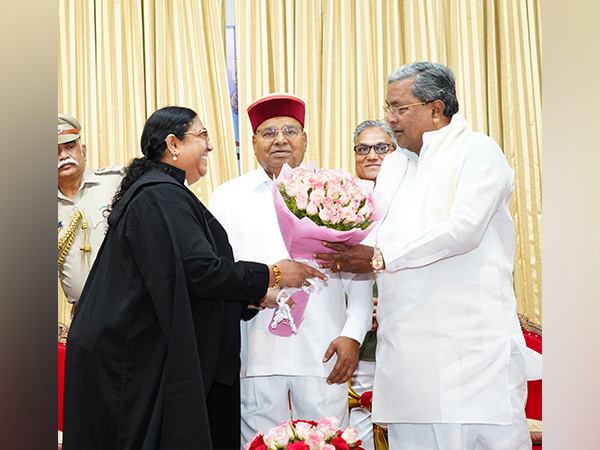 Justice Sudha Perugu with CM Siddaramaiah (Photo/ANI)