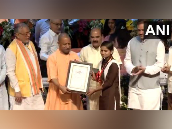 Uttar Pradesh CM Yogi Adityanath felicitates meritorious students (Photo/ANI)