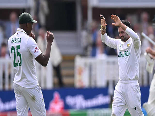 South Africa's Keshav Maharaj celebrating with teammate Kagiso Rabada (Photo: ICC)