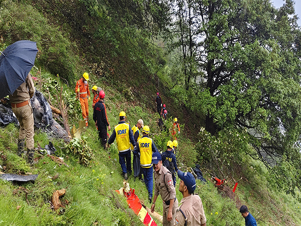 Rescue personnel at the site of the chopper crash in Uttarakhand (Photo/ANI)