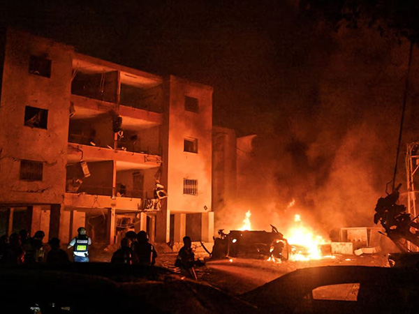 Firefighters and rescue personnel work at an impact site following missile attack from Iran on Israel, in Haifa, Israel (Image/Reuters)