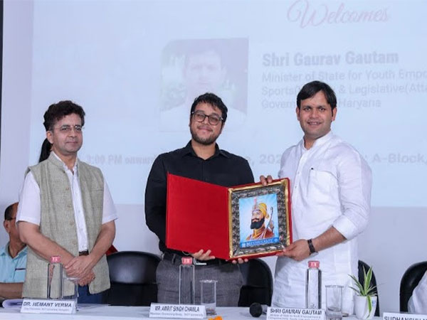 Prof. (Dr.) Hemant Verma, Vice Chancellor, SGT University, and Amrit Singh Chawla, Member, Governing Body, presenting a memento to Gaurav Gautam, State Minister, Haryana, at the event