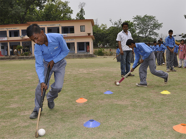 School children playing Hockey (Photo: ANI)