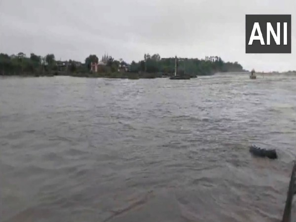 Ramghat dam on Ghela river overflows following heavy rain in Gadhada in Botad district (Photo/ANI)