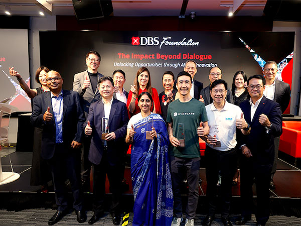 Group photo featuring Impact Beyond winners, Impact Beyond Dialogue panellists, and representatives from DBS and DBS Foundation