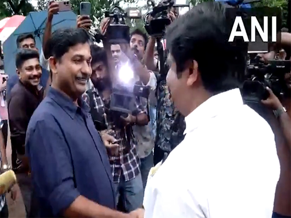 LDF candidate M Swaraj and UDF candidate Aryadan Shoukath greeting each other (Photo/ANI)