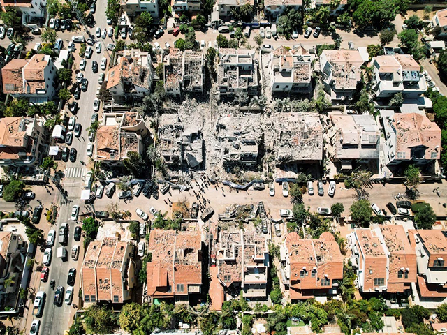 Drone photo shows the damage over residential homes and at the impact site following missile attack from Iran (Photo/Reuters)