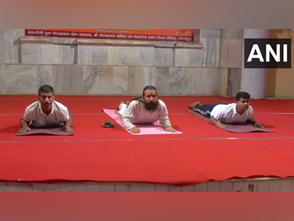 People perform yoga at the 'Weekly Yoga Camp' at Gorakhnath Temple Complex (Photo/ANI)