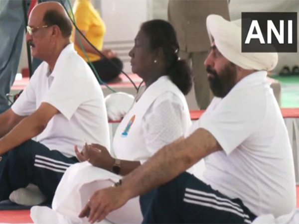 President Droupadi Murmu (middle) attending International Yoga Day celebrations (Photo/ANI)