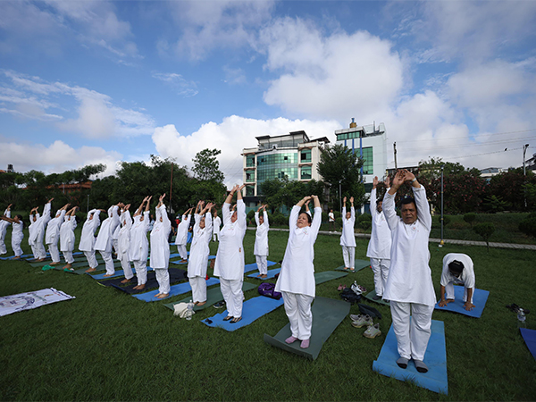 People perform yoga in Nepal on the occasion of International Day of Yoga (Photo/ANI)