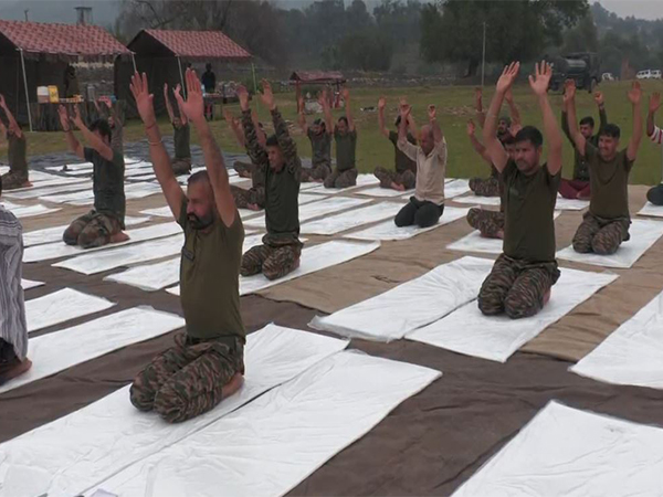 Army personnel and locals perform Yoga in Poonch on Yoga Day (Photo/ANI)