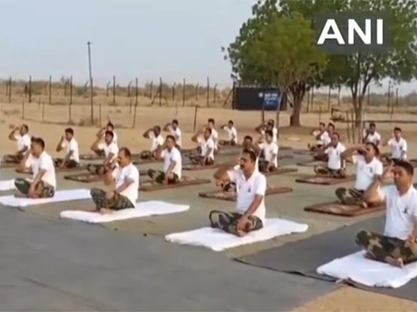 BSF) personnel performed yoga on occasion of International Yoga Day in Rajasthan's Jaisalmer. (Photo/ANI)