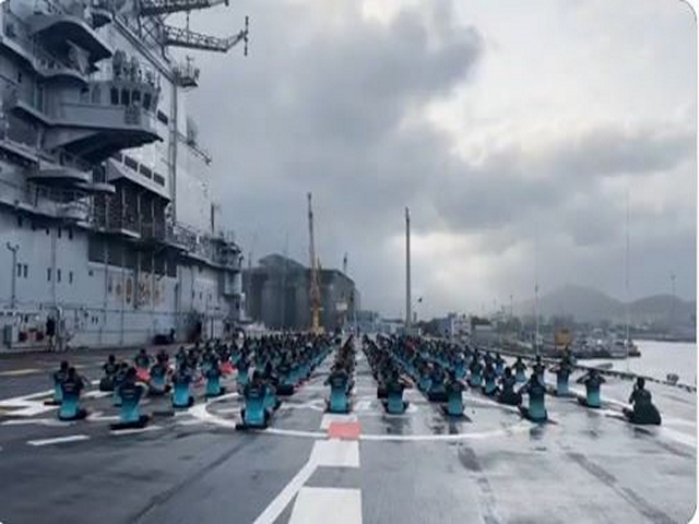 Navy personnel performing various yoga asanas on the deck of  INS Vikramaditya (Photo/ANI)