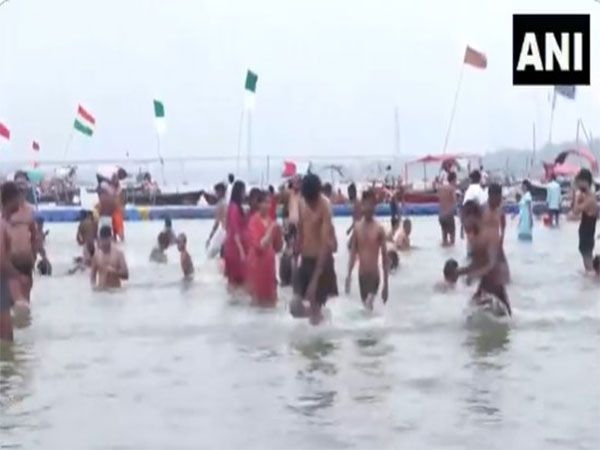 Devotees take holy dip in Triveni sangam on the occasion of Yogini Ekadashi. (Photo/ANI)