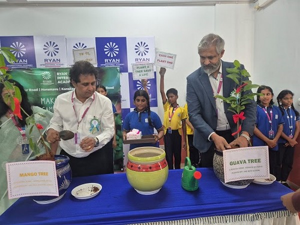 Rotarians Mahesh Hariharan and Neil Michael Joseph plant trees at RIA, Horamavu, promoting a green future through the “Each One Plant One” initiative