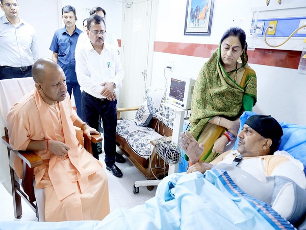 Uttar Pradesh Chief Minister Yogi Adityanath during his visit to KK hospital to meet injured MLA Fateh Bahadur Singh 