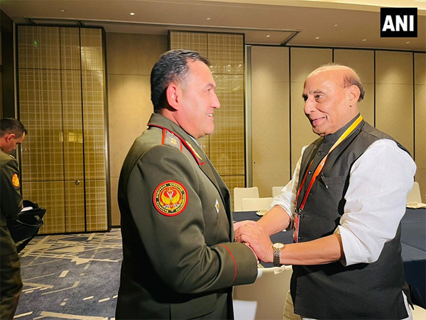 Defence Minister Rajnath Singh with Tajikistan counterpart Emomali Sobirzoda in Qingdao (Photo/ANI)