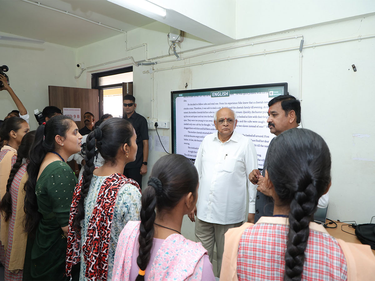 Gujarat Chief Minister Bhupendra Patel interacting with children of PM Shri Model School (Photo/@Bhupendrapbjp)