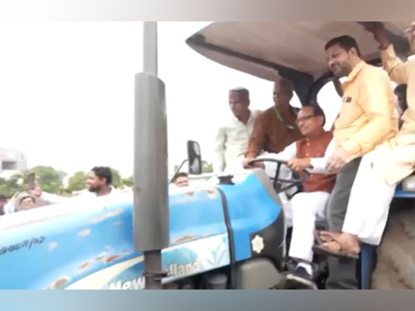 Union Minister Shivraj Singh Chouhan drives tractor during his Indore visit (Photo/ANI)
