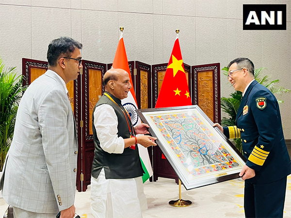Defence Minister Rajnath Singh presents Madhubani painting to Chinese Defence Minister Don Jun (Photo/ANI)