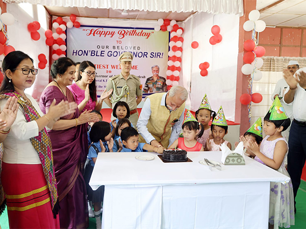 Arunachal Pradesh Governor Lt. General KT Parnaik (Retd.) celebrates his birthday in midst of children from Oju Mission school (Photo/ANI)