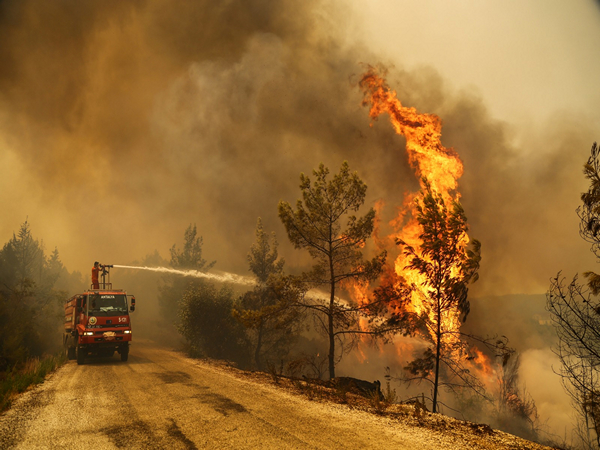 Turkish wildfire leaves charred home and ashes, as blazes spread. (Photo/Reuters)