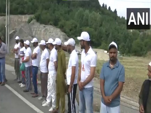 The people in South Kashmir gear up to welcome the first batch of Amarnath Yatra pilgrims, at the Navyug Tunnel in Qazigund. (Photo/ANI)