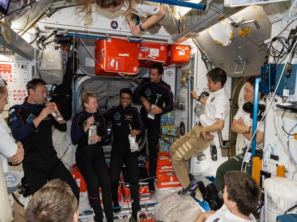 The Axiom Mission 4 private astronauts gather with drink pouches inside the International Space Station. (Photo/ NASA)