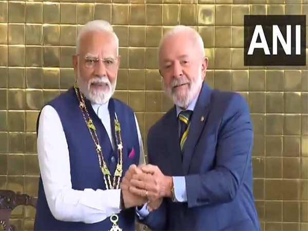 PM Modi receiving Brazil’s highest civilian honour from President Silva (Photo/ ANI) 