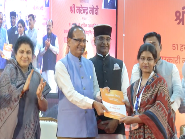 Union Minister Shivraj Singh Chouhan handing over the appointment letter (Photo/ANI)