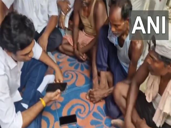 Congress MP Rahul Gandhi, engages in a telephonic conversation with family members (Photo/ANI) Congress MP Rahul Gandhi, engages in a telephonic conversation with family members (Photo/ANI)