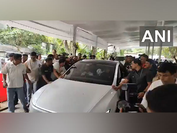 Maharashtra Dy CM Eknath Shinde took a ride in the Tesla car outside the Vidhan Bhavan (Photo/ANI)