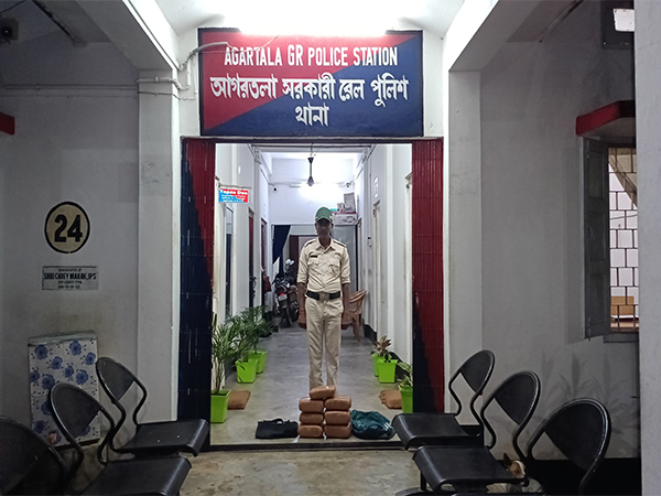 Railway Police personnel with seized 9.5 kg of dry ganja. (Photo/ANI)