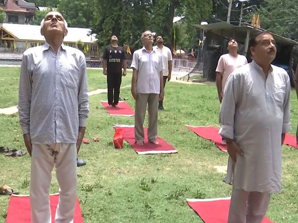 Amarnath devotees during a Yoga session in Anantnag, Jammu and Kashmir. (Photo/ANI)