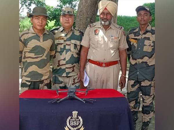 BSF personnel with the recovered drone (Photo/BSF)