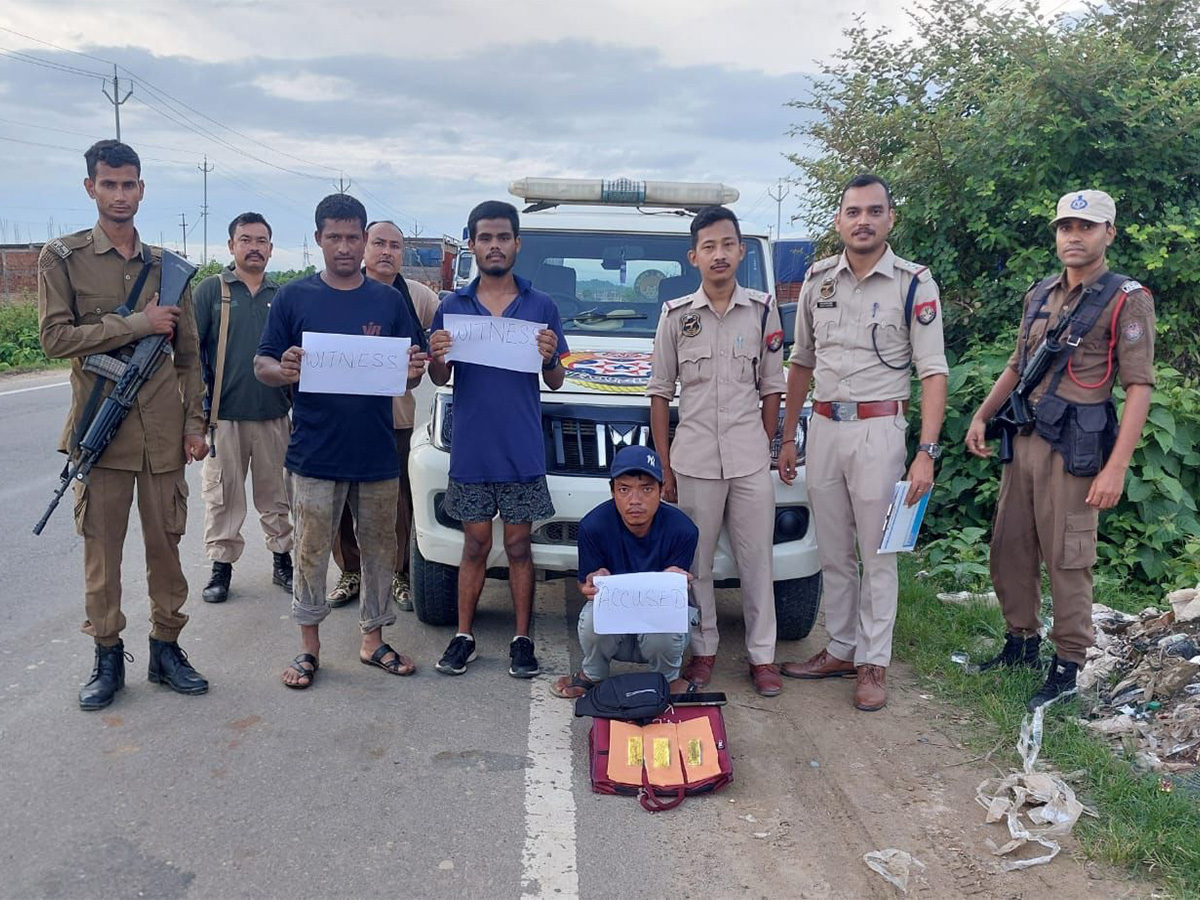  Police apprehend one person (sitting) in Assam's Cachar district. (Photo/ANI)