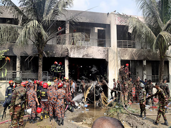 Firefighters and soldiers at the crash site of a Bangladesh Air Force training jet in Dhaka. (Source: Reuters) Firefighters and soldiers at the crash site of a Bangladesh Air Force training jet in Dhaka. (Source: Reuters)