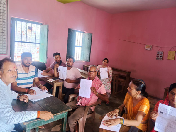 Voters filling the enumeration form (Photo/ANI)