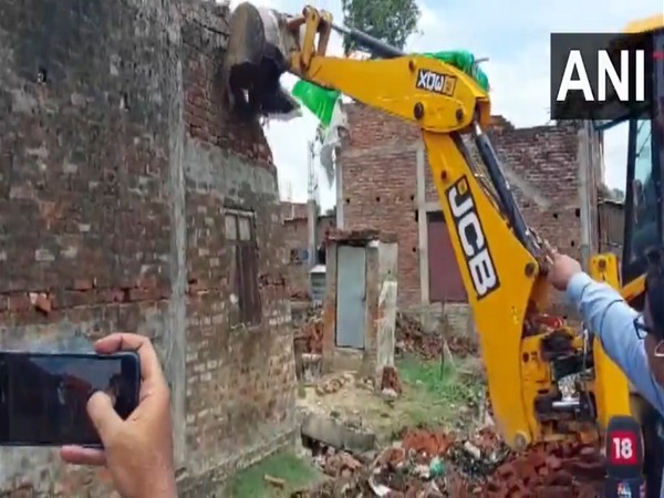 Bulldozer action on the properties of Sabroz, an aide of Chhangur (Photo/ANI)