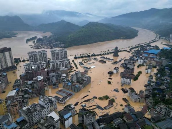 A drone view shows buildings and roads are half submerged in floodwaters after heavy rainfalls, in Rongjiang county, Guizhou province (Image/Reuters)