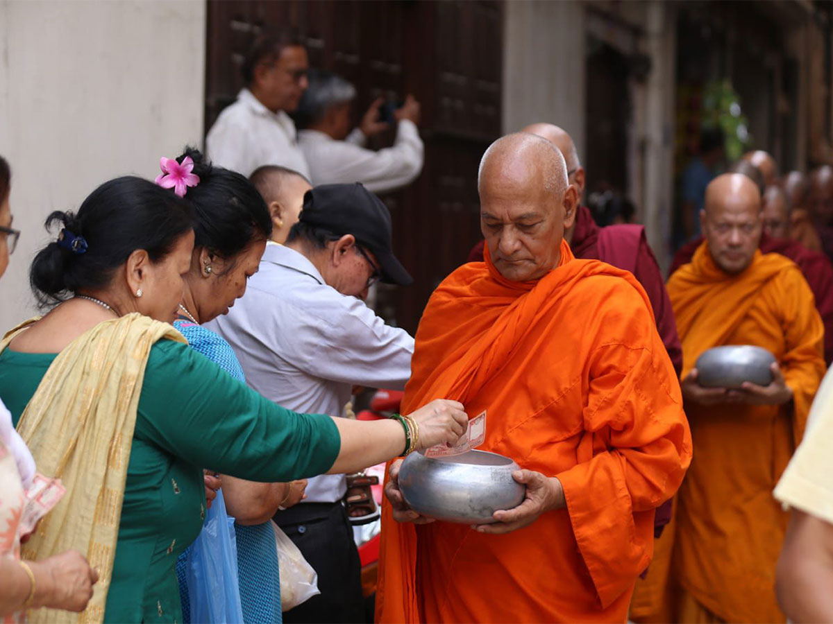 Barefooted monks walk through the ancient streets of a Nepalese town. (Photo/ANI)